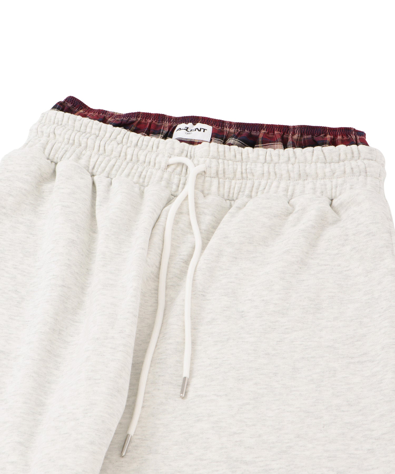 Check shorts layered sweatpants